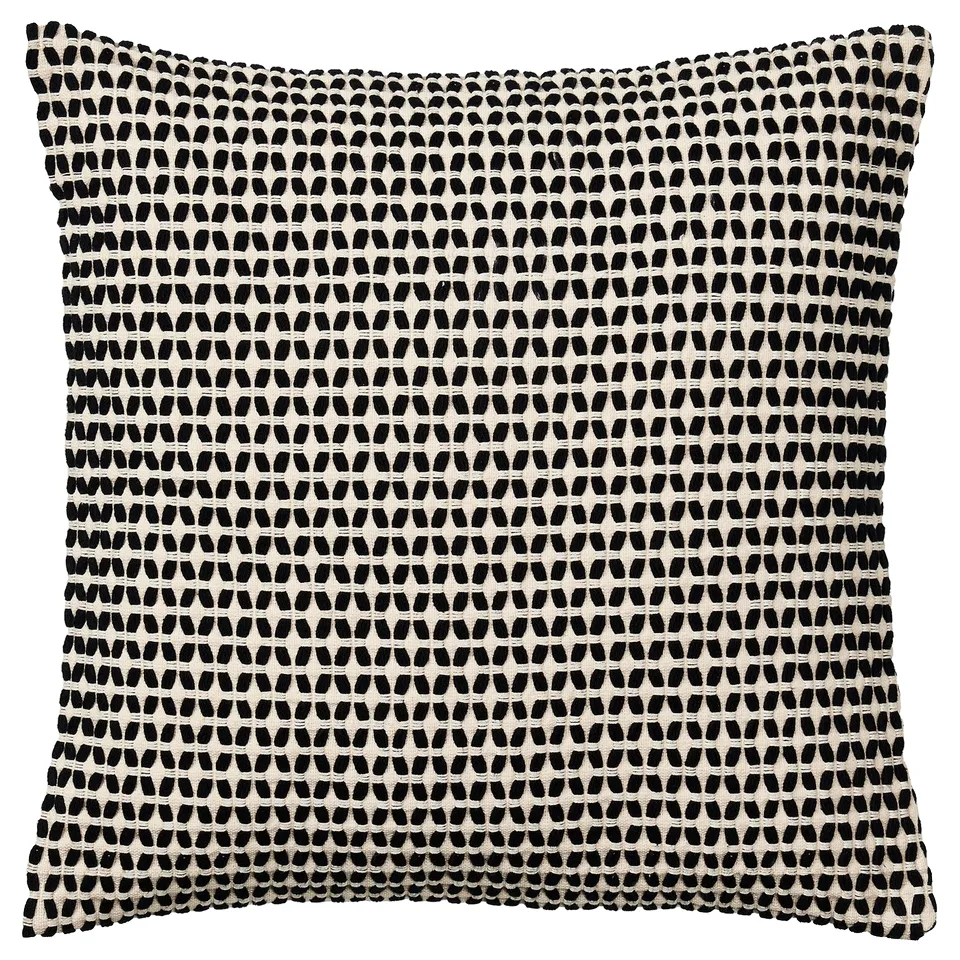 A KUSTFLY square throw pillow with black and beige geometric design. Made of cotton and polyester, it a zip for easy washing.