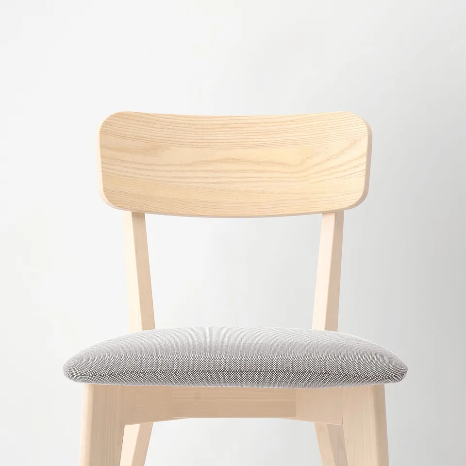 Minimalist chair with natural wood frame & padded seat. Perfect for modern spaces.