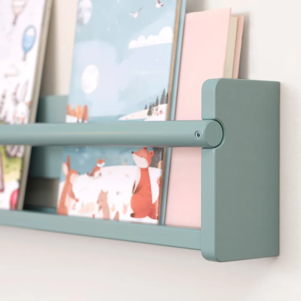 Light green wooden shelf with colourful childrens books and illustrations.