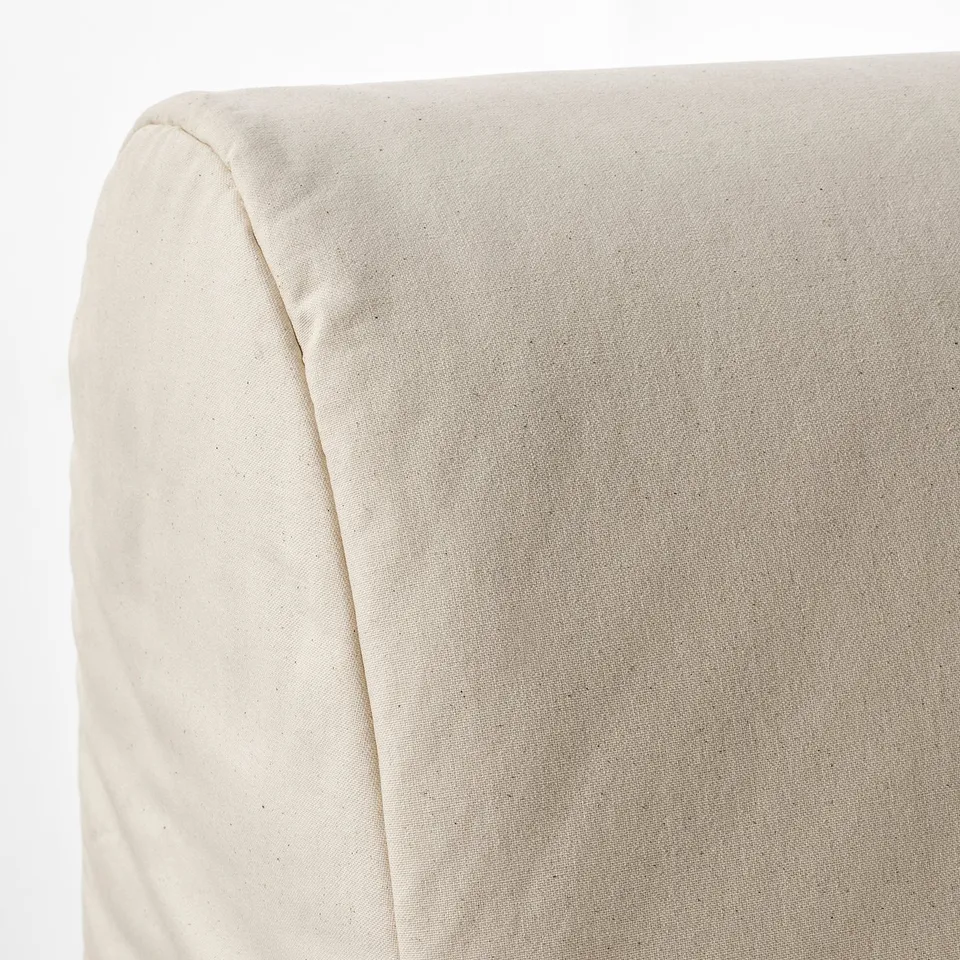 Close-up of lycksele lovas sofas smooth, neutral fabric. Shows high-quality upholstery, clean lines, and durable design.
