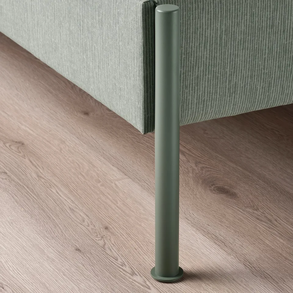 Modern bed frame with green metal legs, striped headboard, on wooden floor.