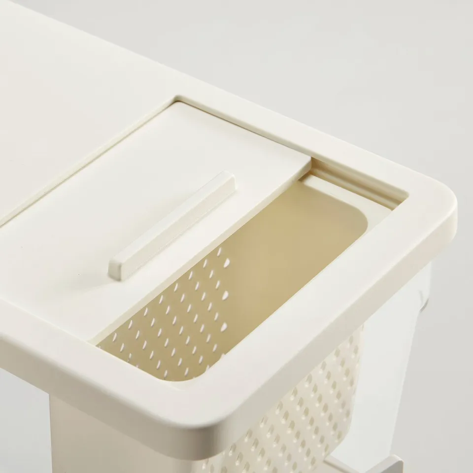 Plastic kitchen container with lid and strainer for easy filling and draining.