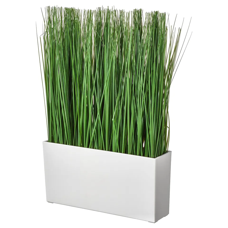 White rectangular planter with tall green artificial grass.
