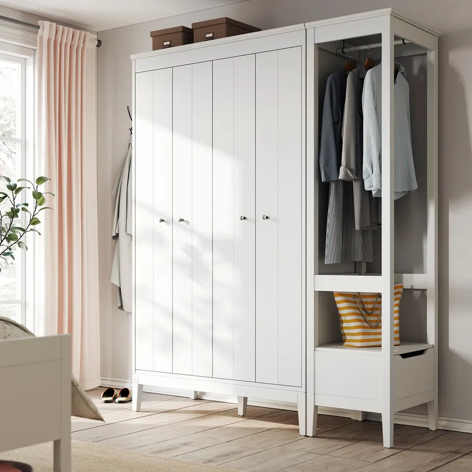 Modern white wardrobe set with bifold doors & open shelves. Hangs & stores clothes neatly. Includes safety fitting for wall attachment.