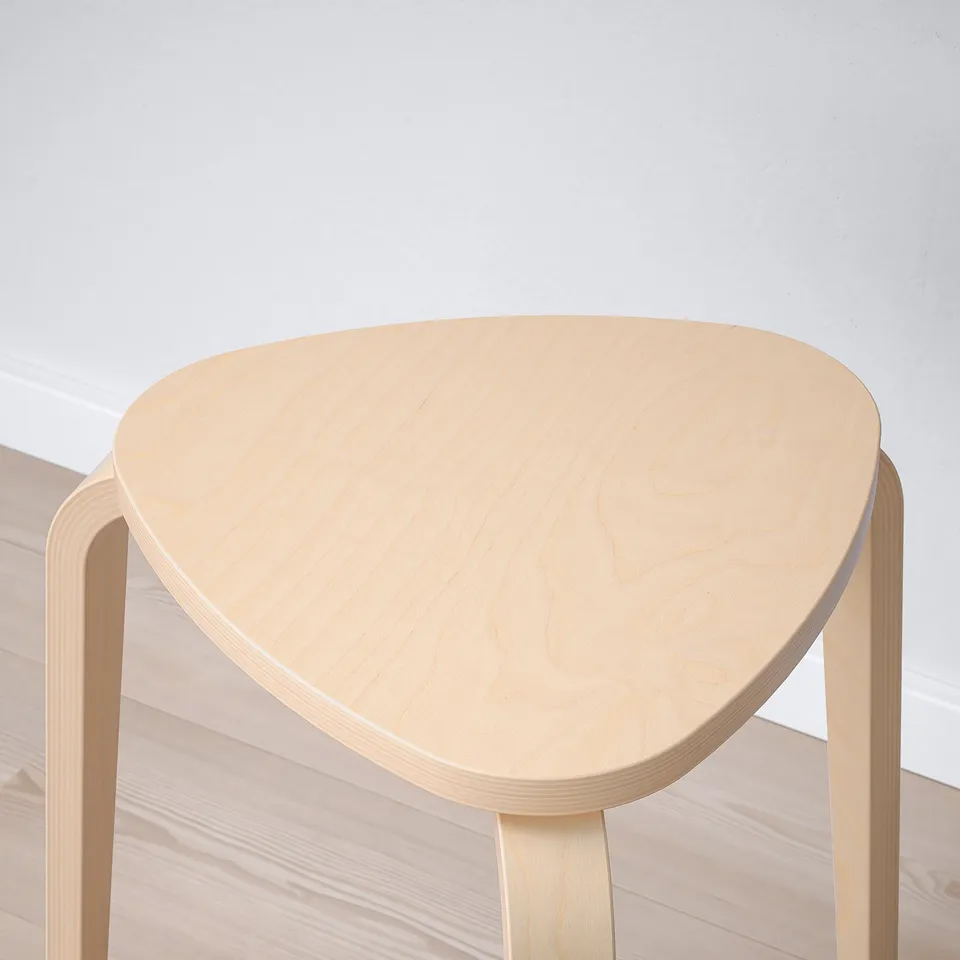 A modern, minimalist chair in natural wood, with a smooth, curved seat, offering comfort and style.