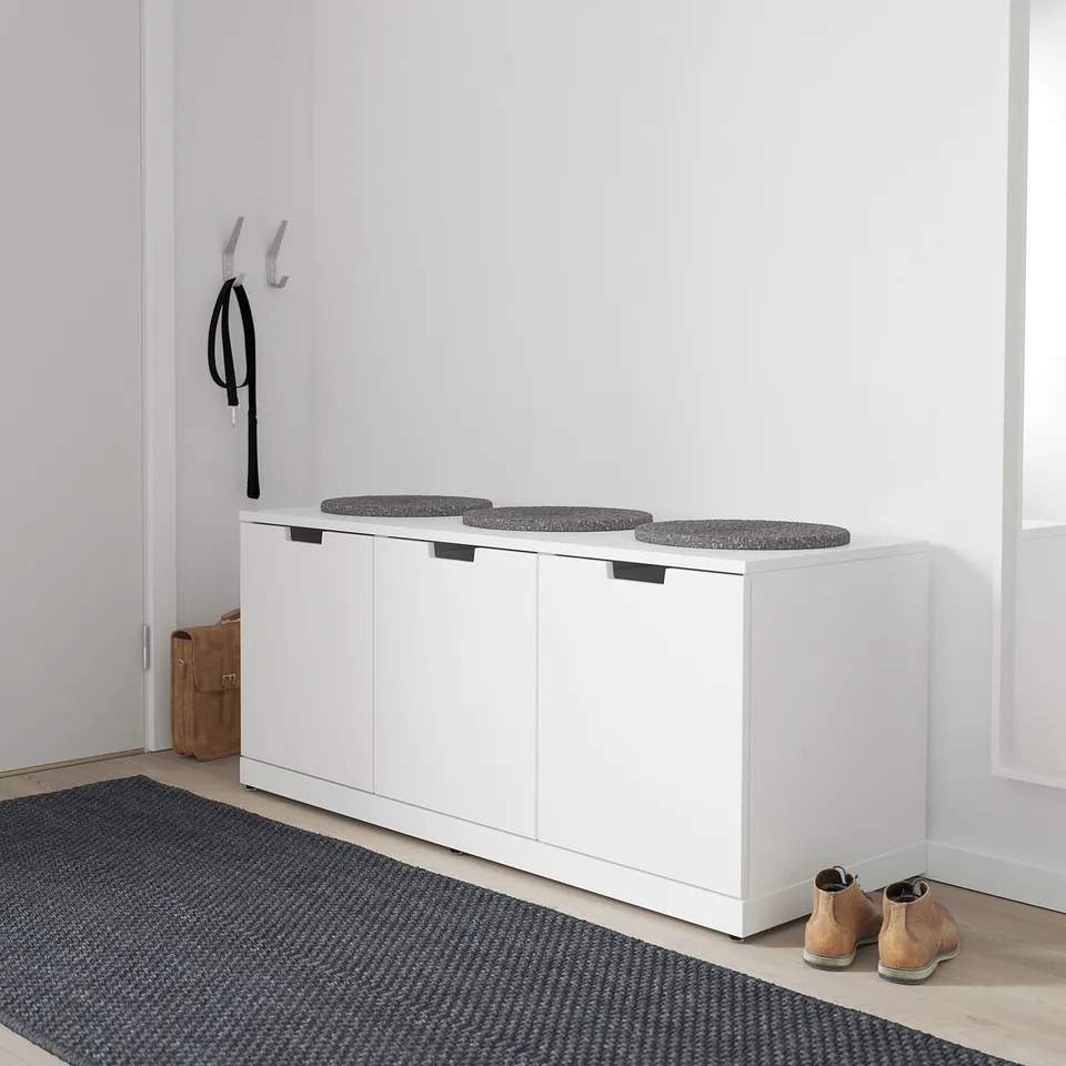 White NORDLI chest with 3 cushions, compact drawers.