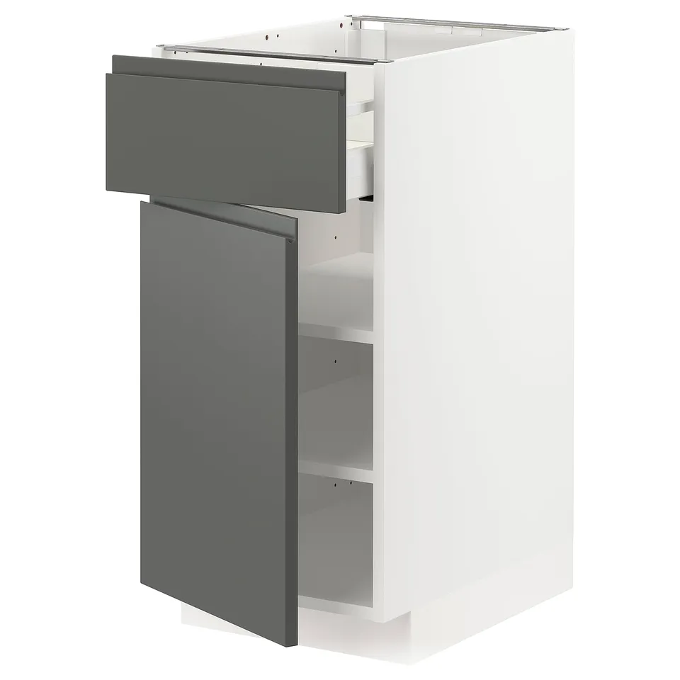 Modern kitchen unit: METOD with dark grey voxtorp drawers and white cabinet. Sleek, integrated handles, medium wood construction.
