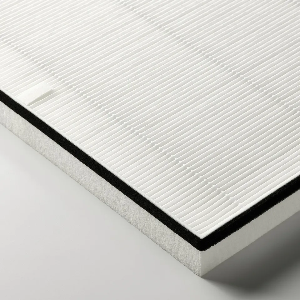 Close-up of a clean, white air philtre with a black border and fine grid pattern; showcasing its meticulous design and quality.
