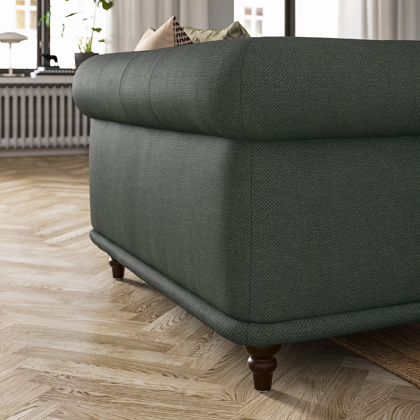 Dark grey VISKAFORS sofa, classic design, rounded edges, wooden legs.