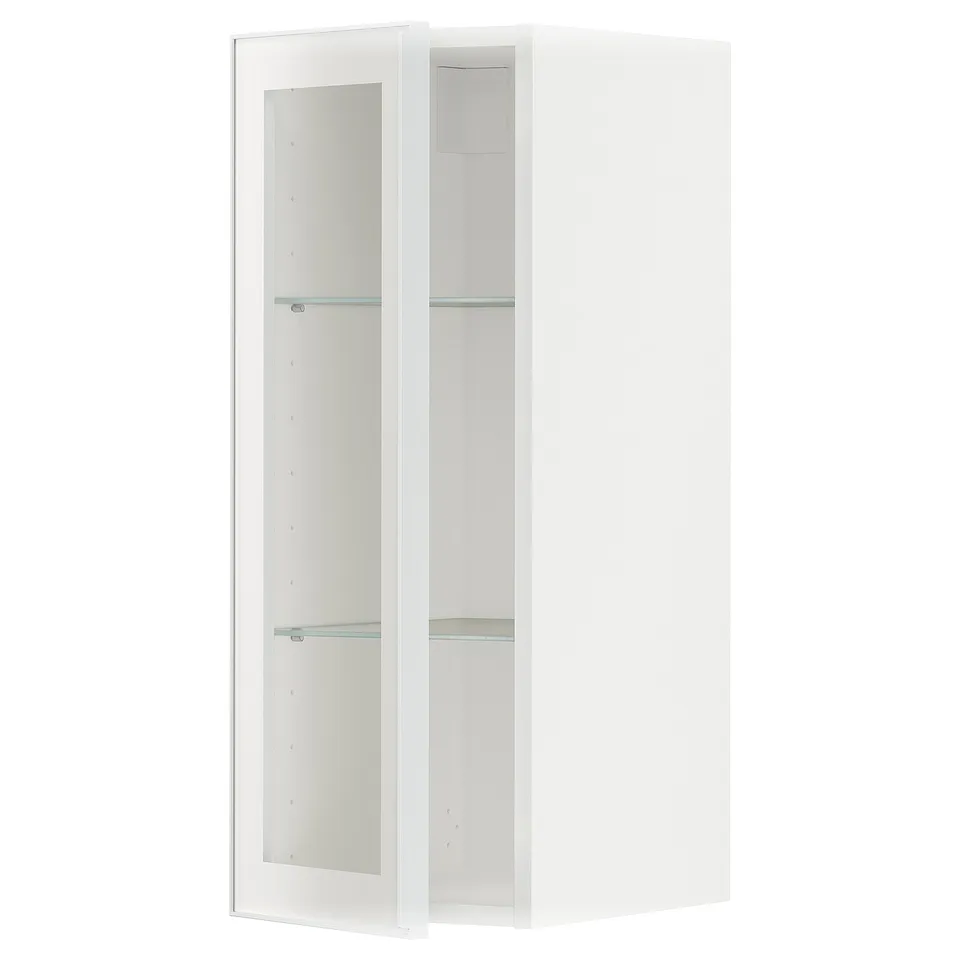 Ikea METOD white kitchen cabinet with glass doors and shelves.