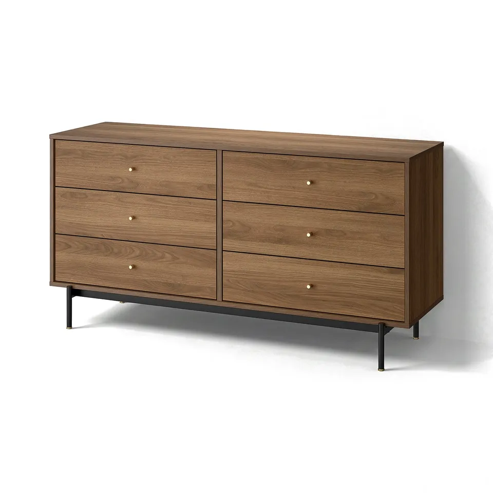 A RÅDMANSÖ wide dresser. Its brown, made of particleboard and metal. Six drawers with brass-like knobs sit on black metal legs.