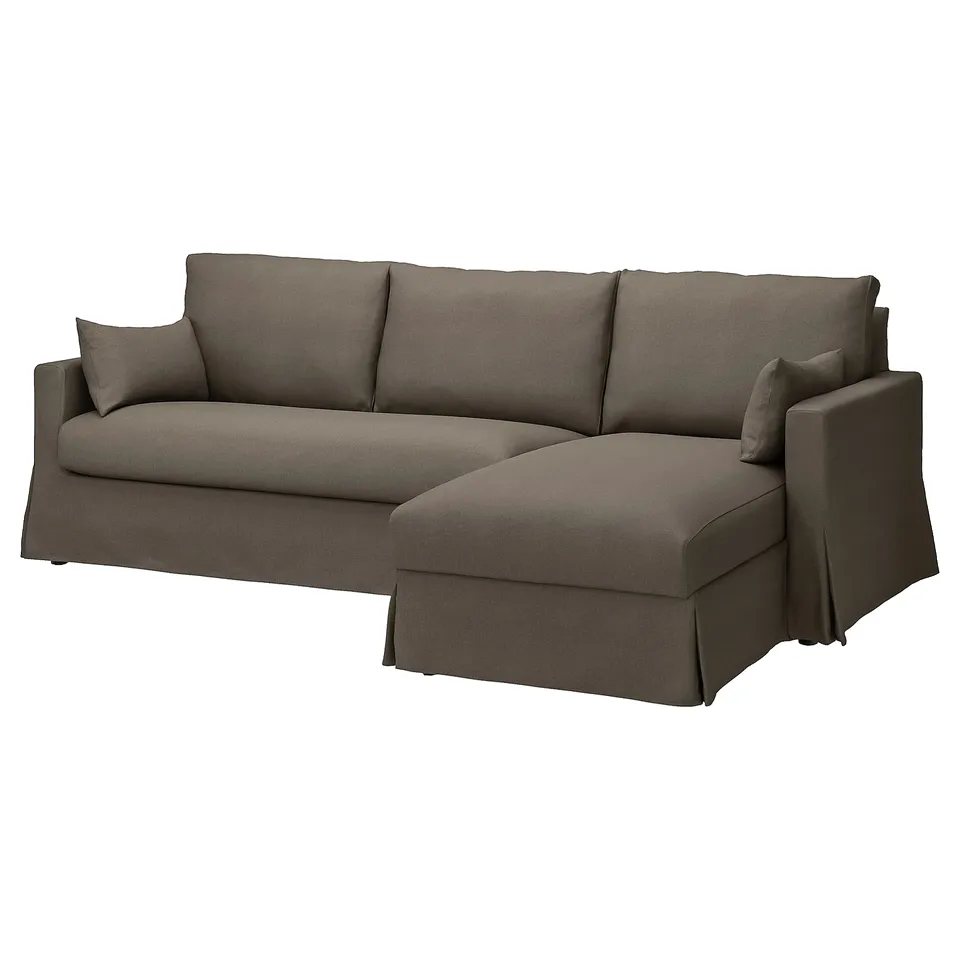 Modern grey l-shaped sectional sofa with ragged edges and oversized cushions.