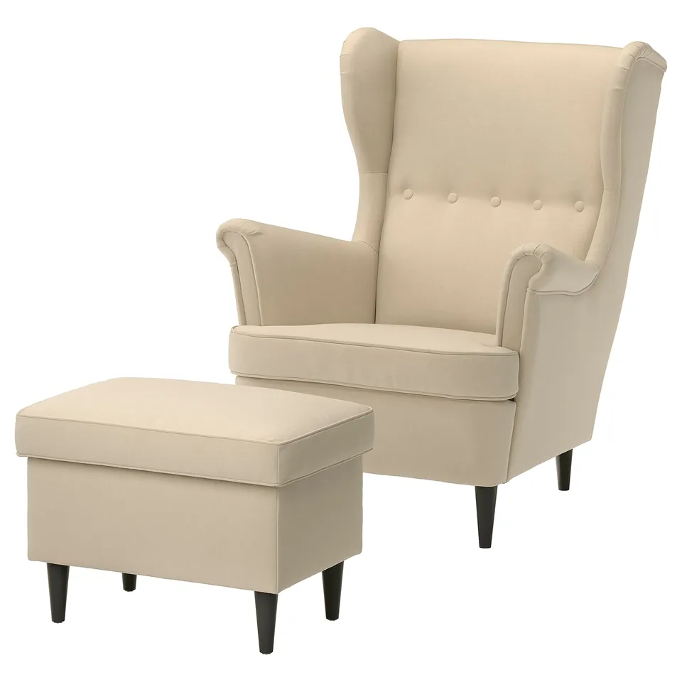 STRANDMON: beige wing chair & ottoman, velvet fabric, high back, dark wood legs, matching storage footrest.
