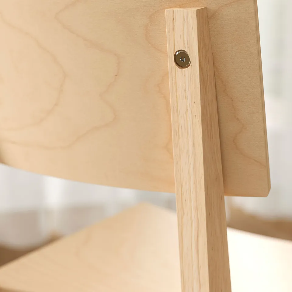 Wooden table edge, natural finish, smooth surface, solid construction.