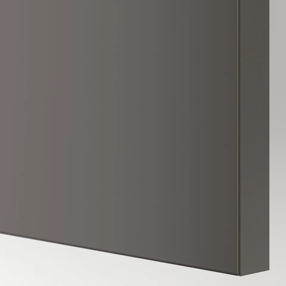 Close-up of sleek, modern dark grey sliding cabinet door with smooth, reflective finish.