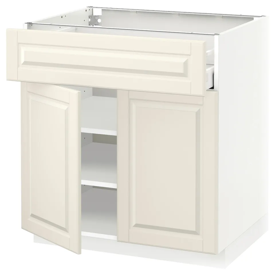 Off-white kitchen cabinet with bevelled edges, two doors, and an open shelf. Modern, minimalist design.