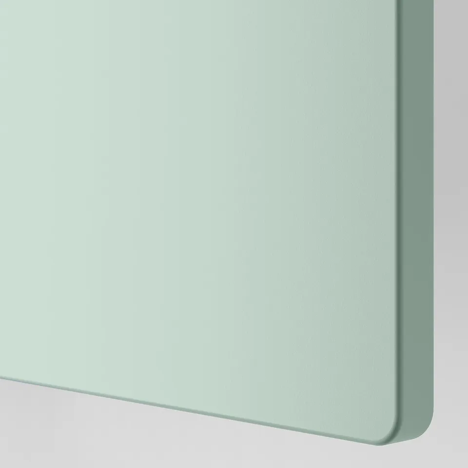 A sleek, modern white chest of drawers, made from smooth particle board and acrylic paint, with clean edges and a sturdy build.