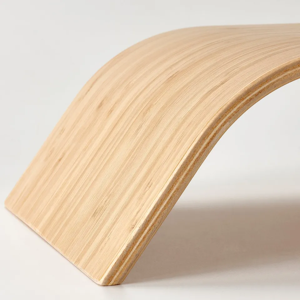 Curved wooden monitor stand made from natural bamboo. Smooth surface and sturdy design for comfort and durability.
