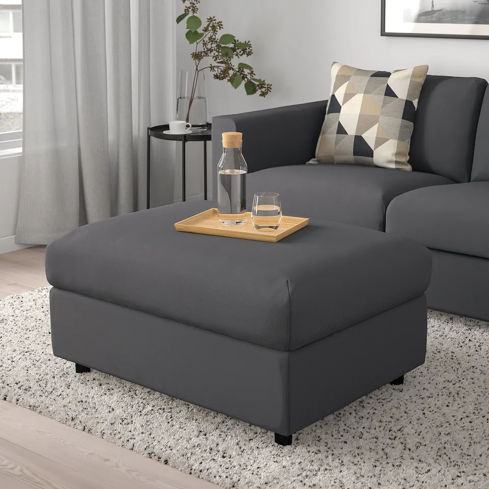 Modern living room with VIMLE sectional, ottoman, pillows, and large window.