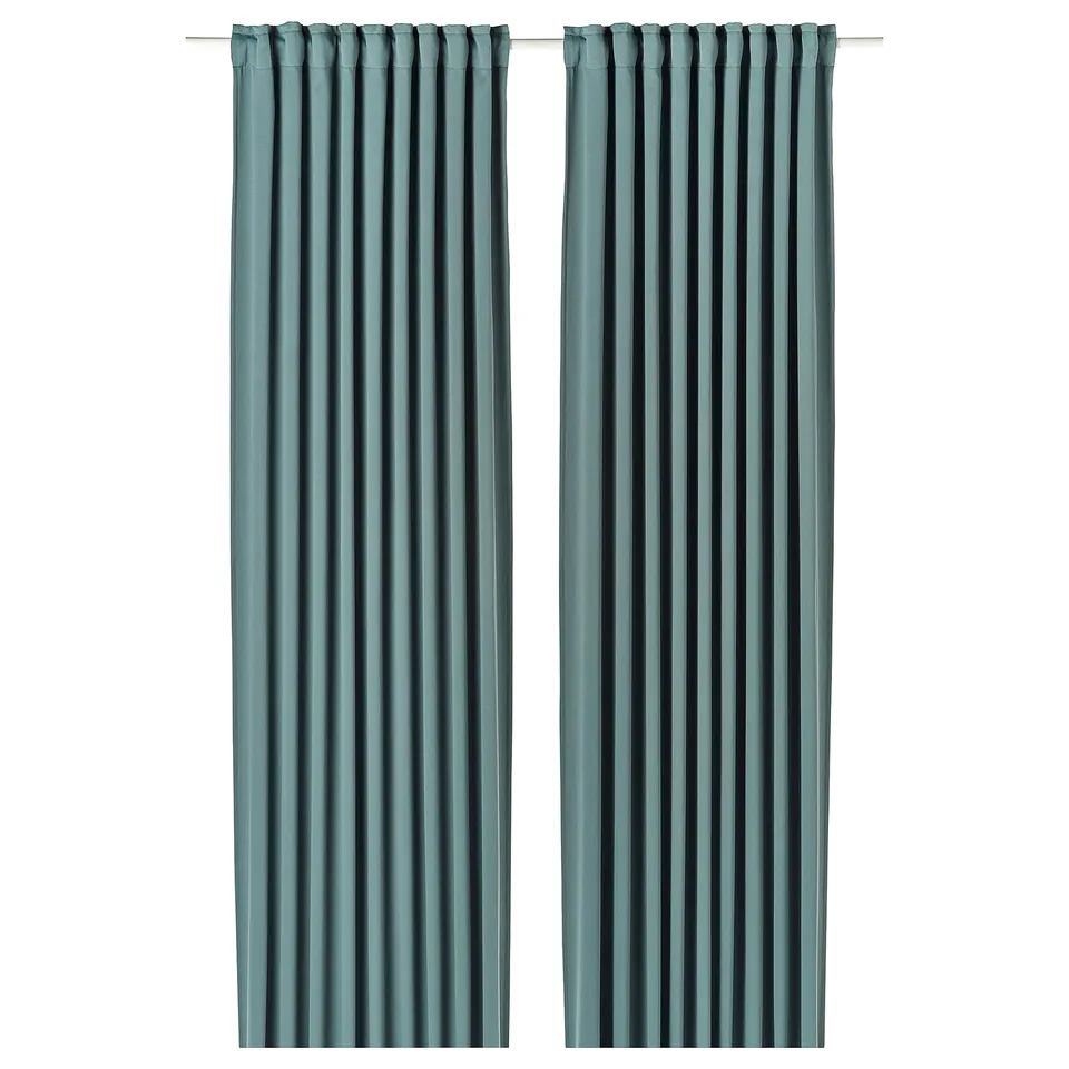 Two dark grey-turquoise MAJGULL room darkening curtains with pleated design hang side by side, offering privacy and light control.