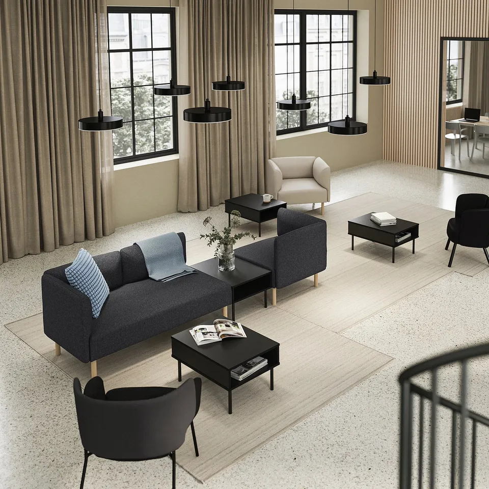 Modern living room with LILLEHEM sofa, black tables, lamps, and large windows with beige curtains.