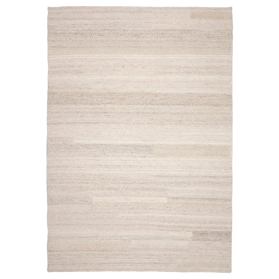 BRÖNDEN rug: neutral, rectangular, handwoven wool & cotton, varied textures.