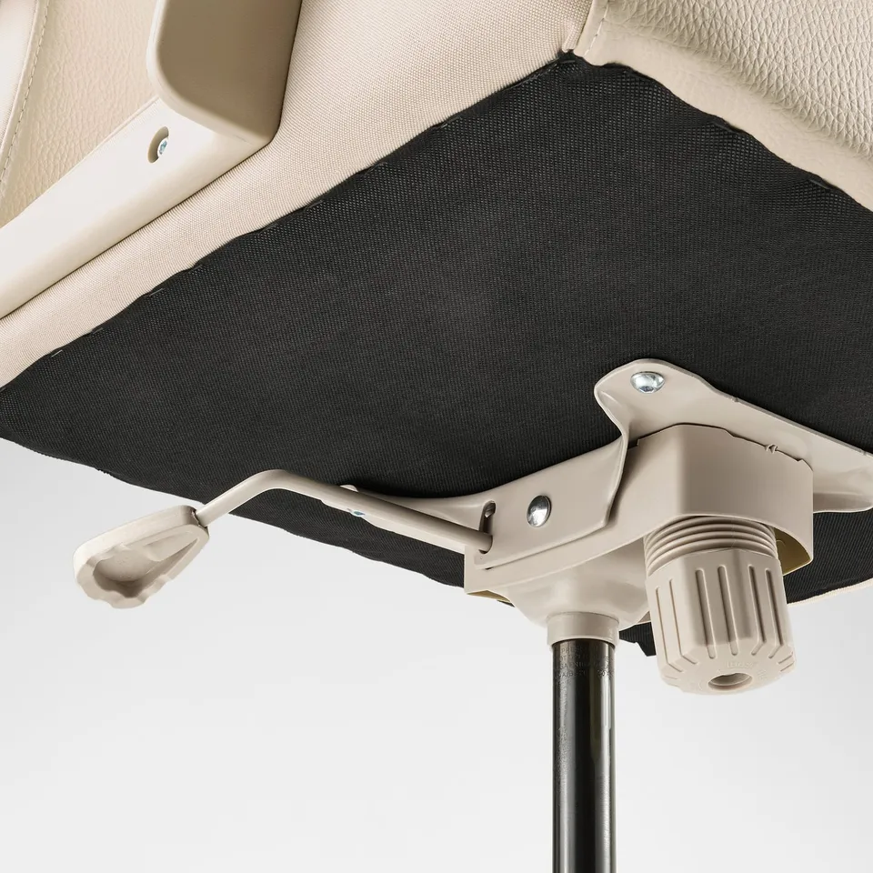 Close-up of chairs adjustable mechanism. Beige lever, grey texture, metal bolts, highlighting sturdy construction and comfort.