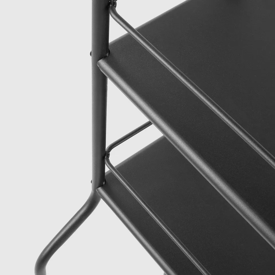 Modern black metal shelf with rounded edges, sturdy frame, clean lines, and minimalist design.