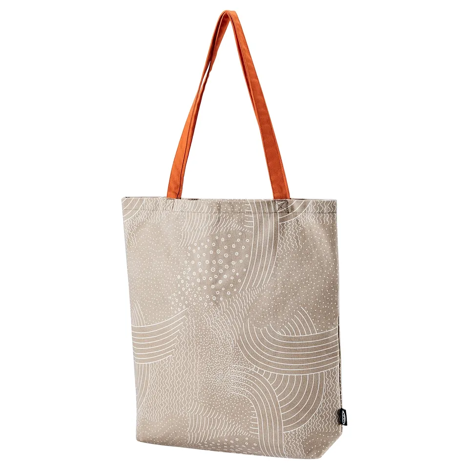 ROMELSÖN canvas tote bag, beige with white abstract pattern, long handles, rectangular shape.