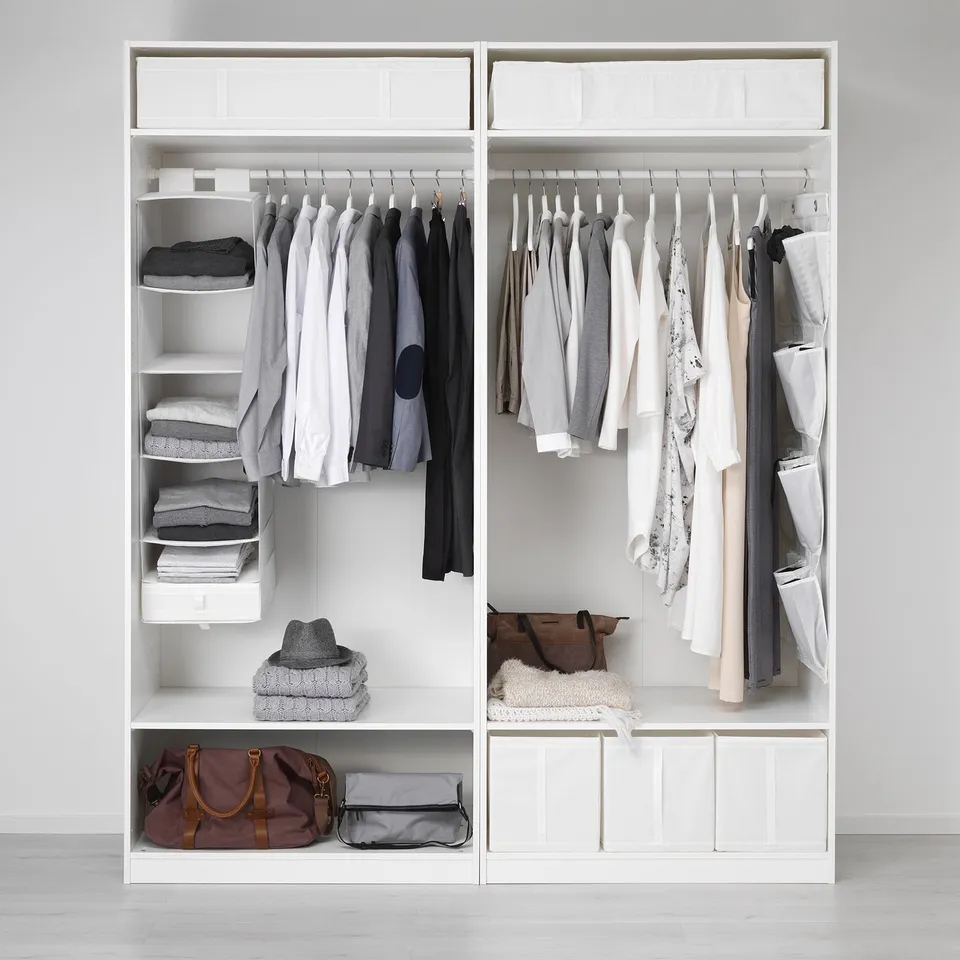 Neatly organised closet with clothes and SKUBB storage boxes.