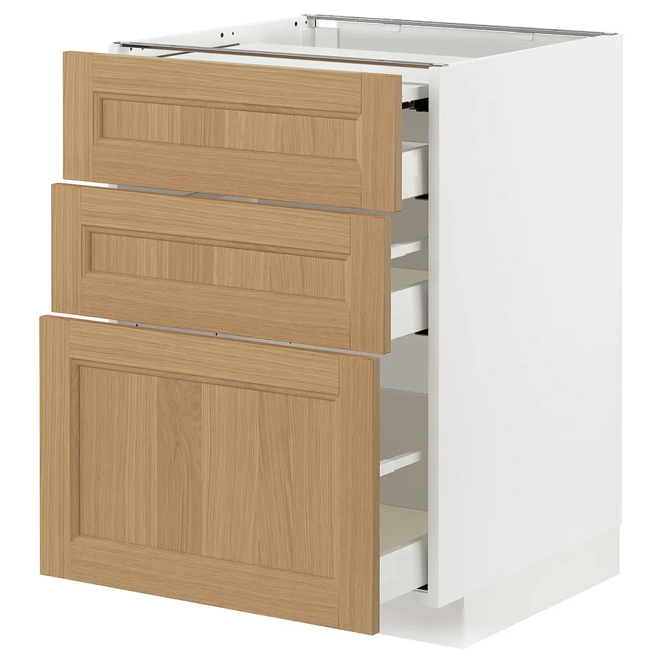 Modern kitchen unit METOD with white frame and oak drawers, featuring multiple drawers.