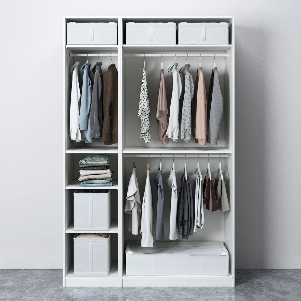 Modern wardrobe with shelves and hanging rails, featuring clothes in shades of blue and beige.