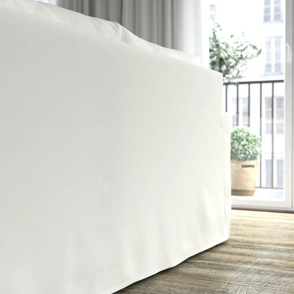 Modern white sofa, soft high-resilience foam, reversible cushions in clean living room.