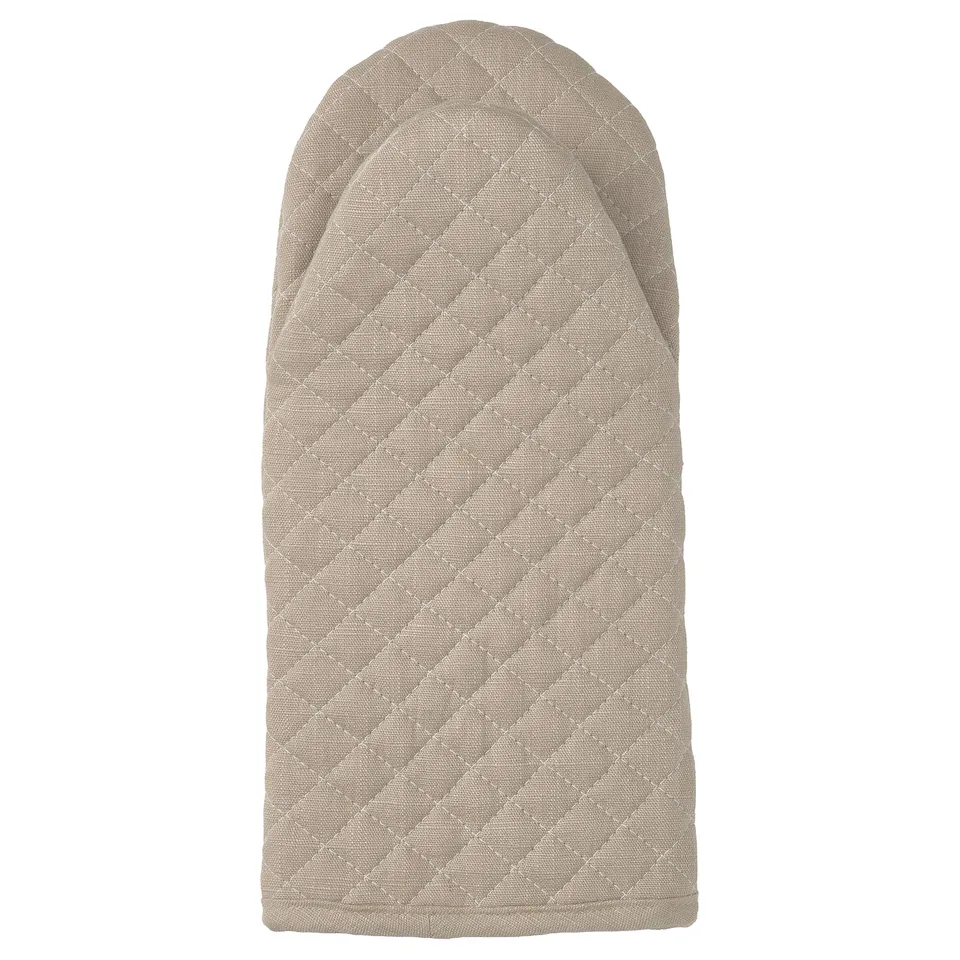 VÄLVÅRDAD beige oven mitt, diamond pattern, recycled materials.