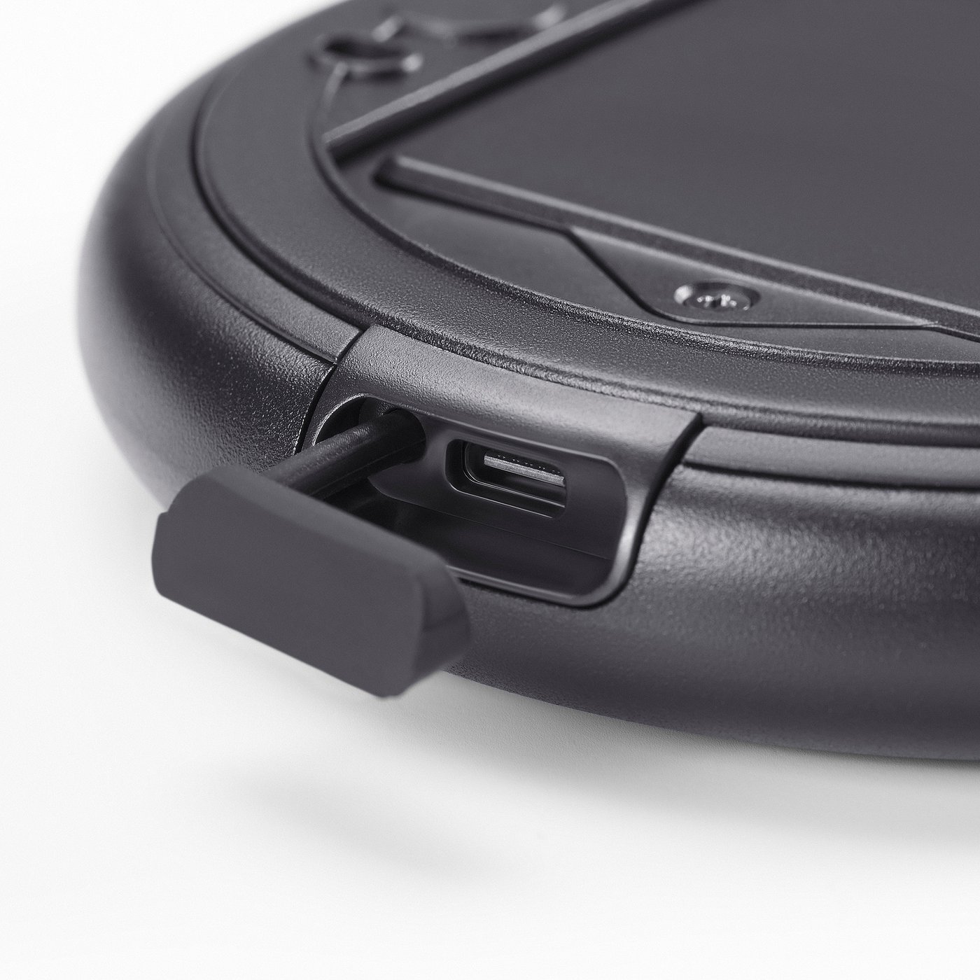 Black handheld magnifying mirror with usb-c port, smooth edges, and secure latch.