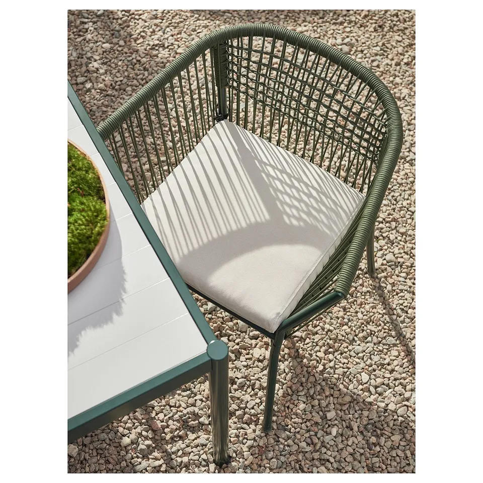 SEGERÖN green outdoor chair with striped cushion. Modern, woven seat; perfect for patio.