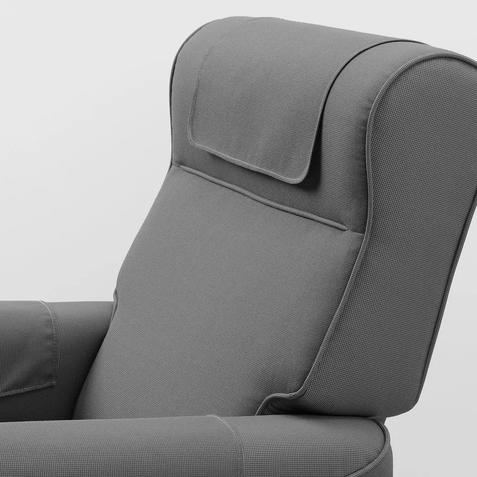 Grey recliner chair with padded headrest, showing sturdy stitching and high-quality fabric.