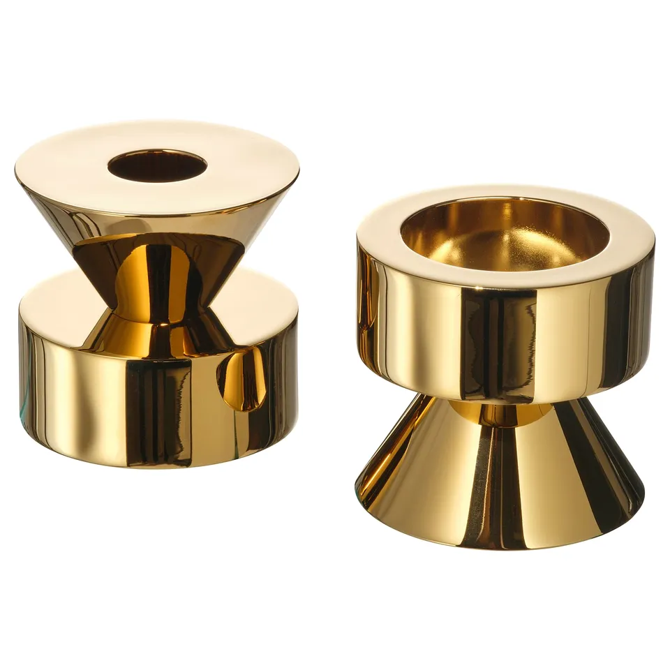 Gold, reversible candlesticks; one side tall candle, other tealight; solid metal, sturdy design.