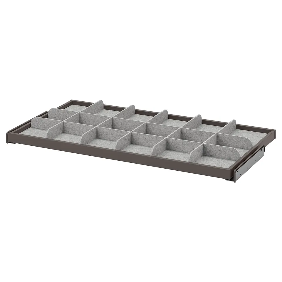 KOMPLEMENT grey organiser tray with multiple compartments for storing accessories and small items, made from durable materials.