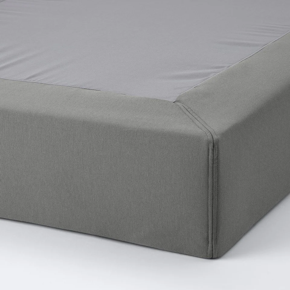 Grey mattress protector with zip for easy cleaning.