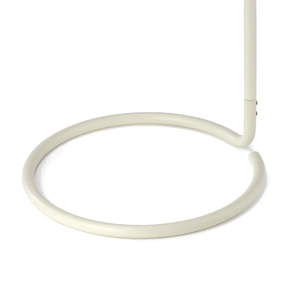 Sleek white modern floor lamp with curved base. High quality design, minimalist aesthetic.