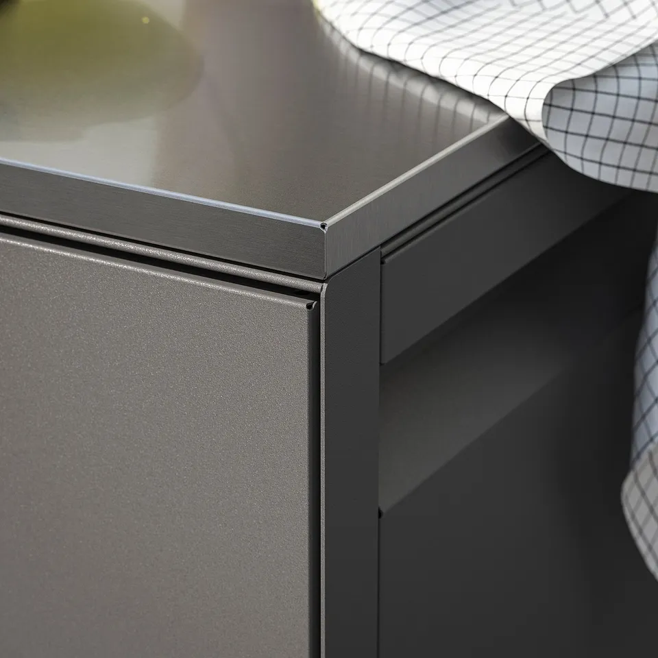 Modern outdoor kitchen with sleek, stainless steel countertop and weather-resistant cabinet.