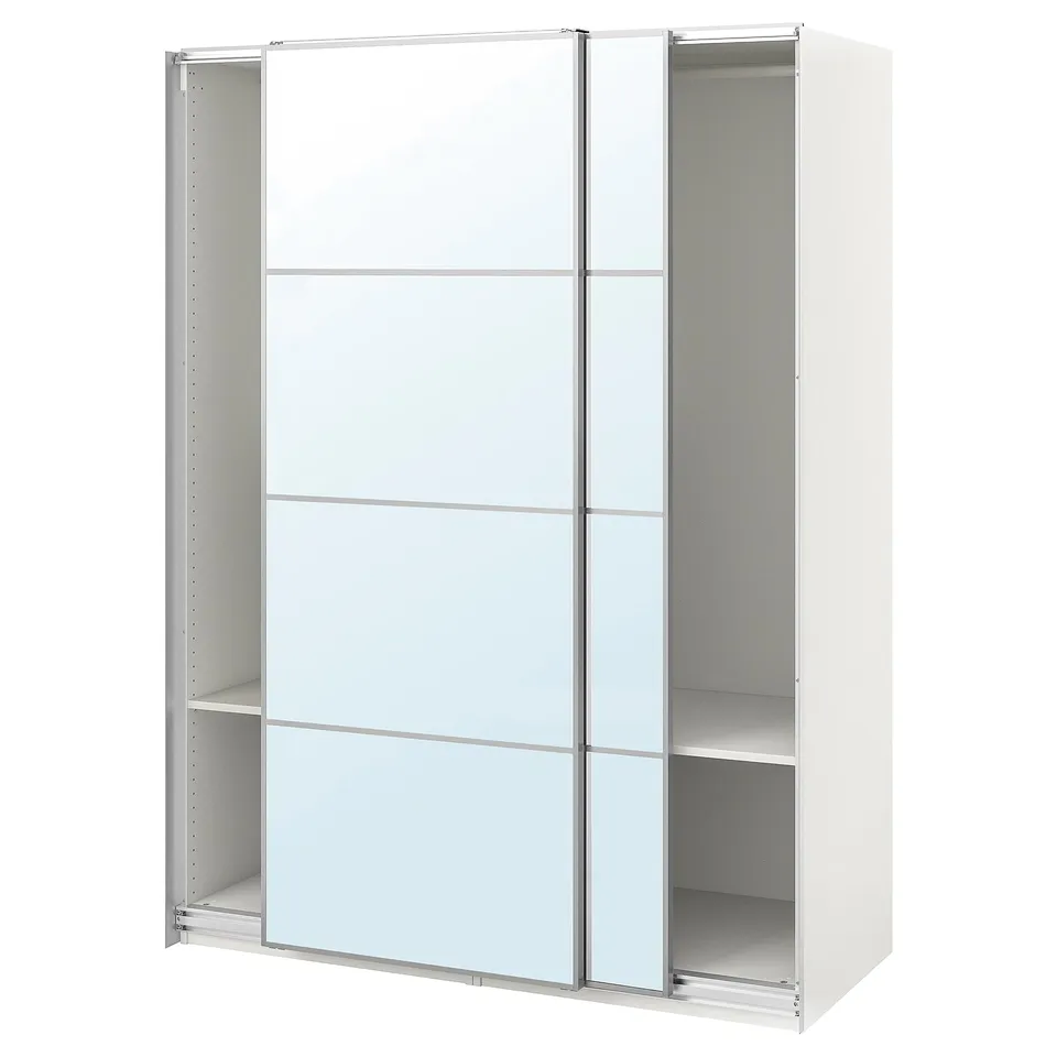 A white ikea PAX wardrobe with mirrored sliding doors and metal storage interior.