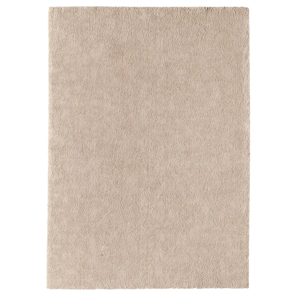 A beige STOENSE area rug with a soft, thick pile. Its rectangular shape offers comfort and sound dampening, perfect for bedrooms or living rooms.