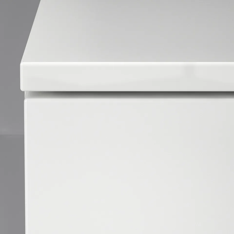 Modern white drawer unit with sleek design.