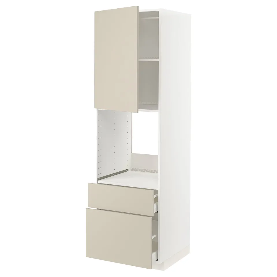 A white METOD kitchen cabinet with beige havstorp fronts, featuring a high frame, drawers, and an adjustable shelf.