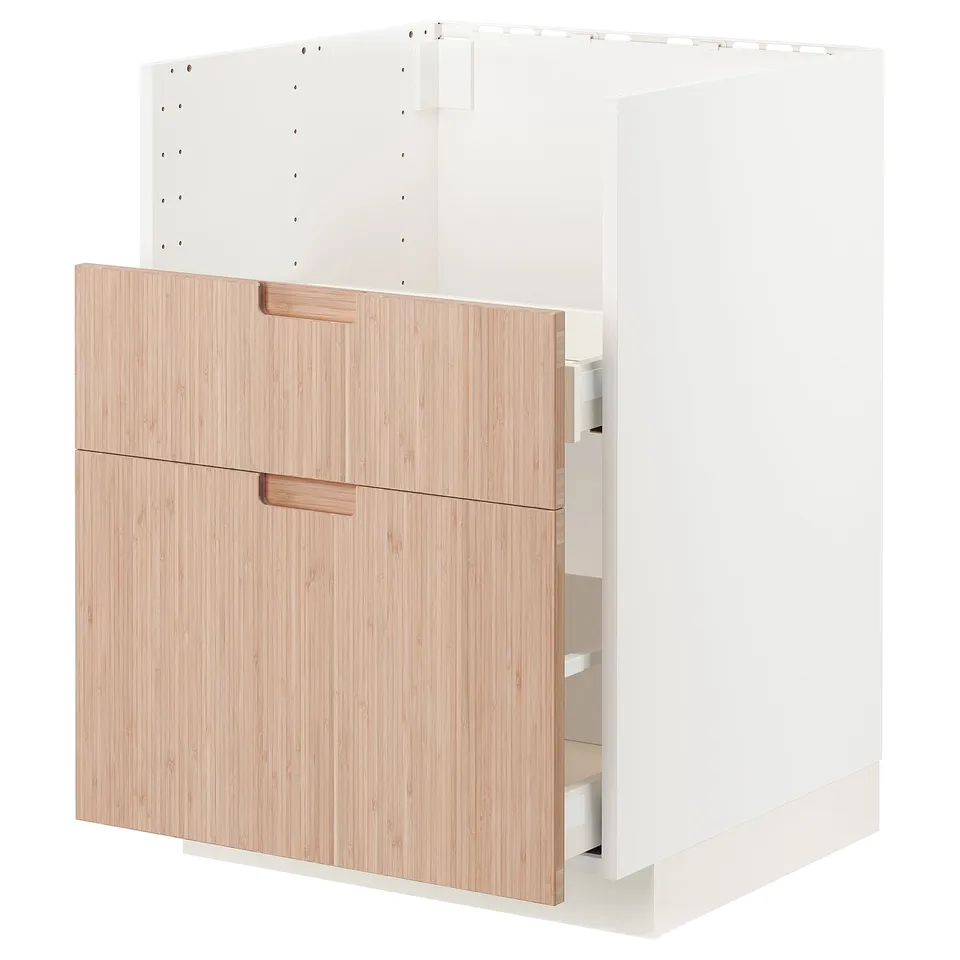 A white and light wooden cabinet with drawers, part of the METOD kitchen system.