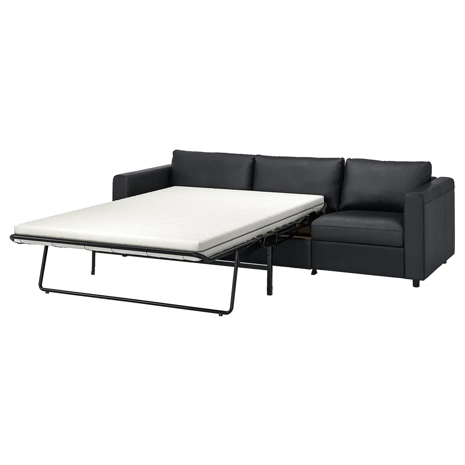 Black VIMLE sofa bed, modern leather, partially opened.