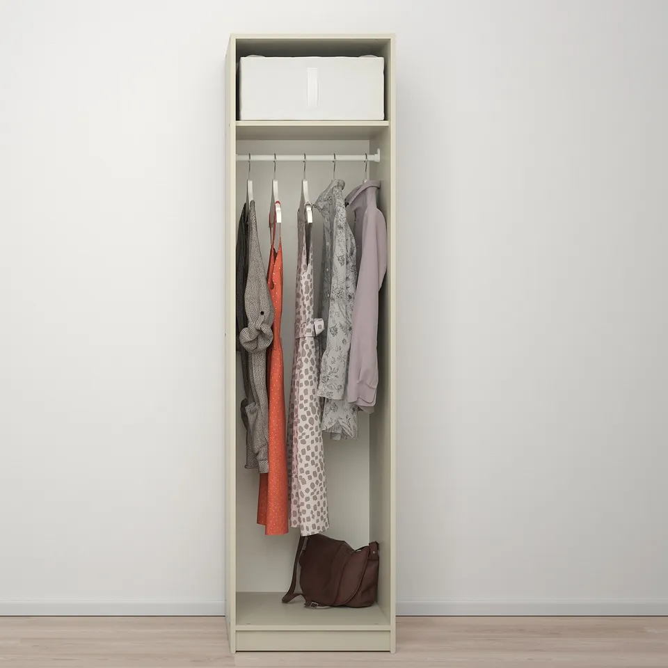 Open wardrobe displaying various clothes, a brown handbag at the bottom; includes rail and shelf.