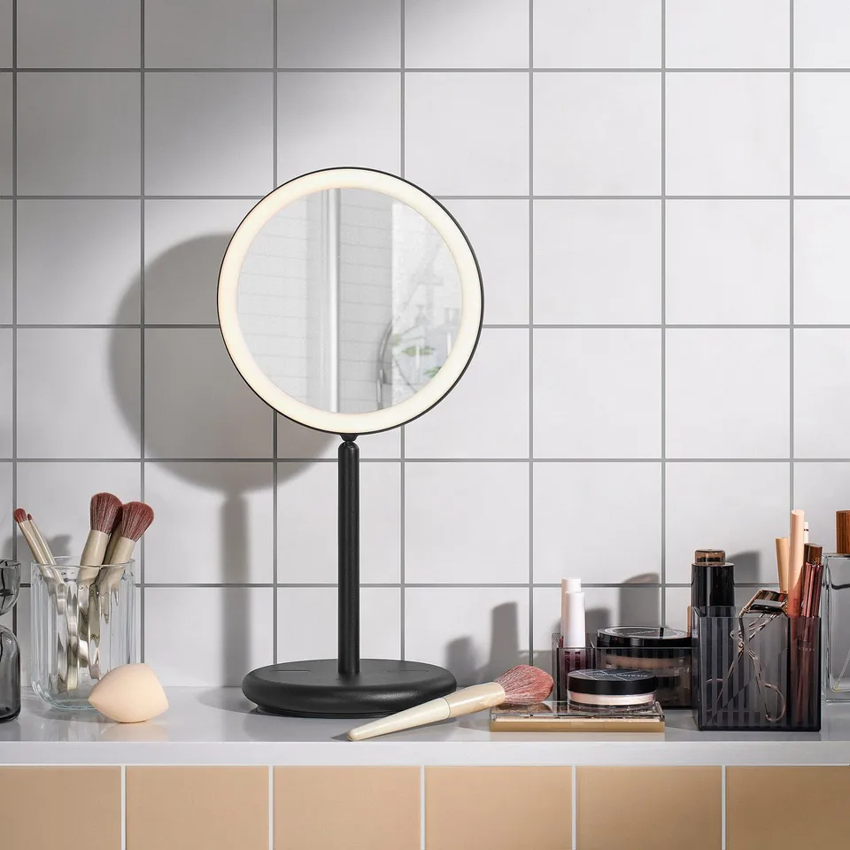Table mirror with light, 1x/3x magnification, adjusts & dims, makeup nearby.